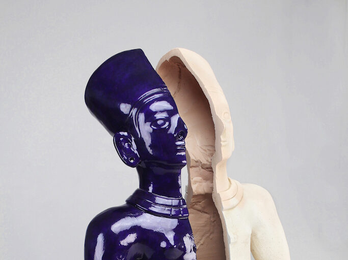 Split Icon: Tulato Standing Figure.